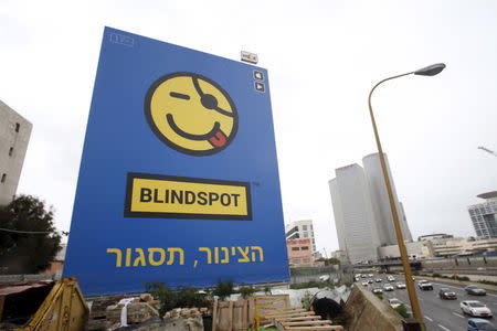 A billboard advertisement for Israeli app Blindspot, which allows people to send text messages anonymously, is seen in Tel Aviv January 25, 2016. REUTERS/Baz Ratner