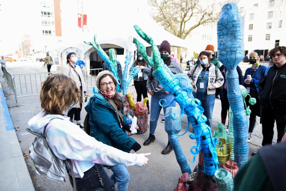 Sarah Nguyen, T/F Art Installations Coordinator, leads Camp True/False students through an art walk of various pieces on Ninth Street and in The Picturehouse at last year's True/False.