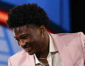 Kai Jones reacts after being selected as the 19th overall selection by the New York Knicks during the NBA basketball draft, Thursday, July 29, 2021, in New York. (AP Photo/Corey Sipkin)