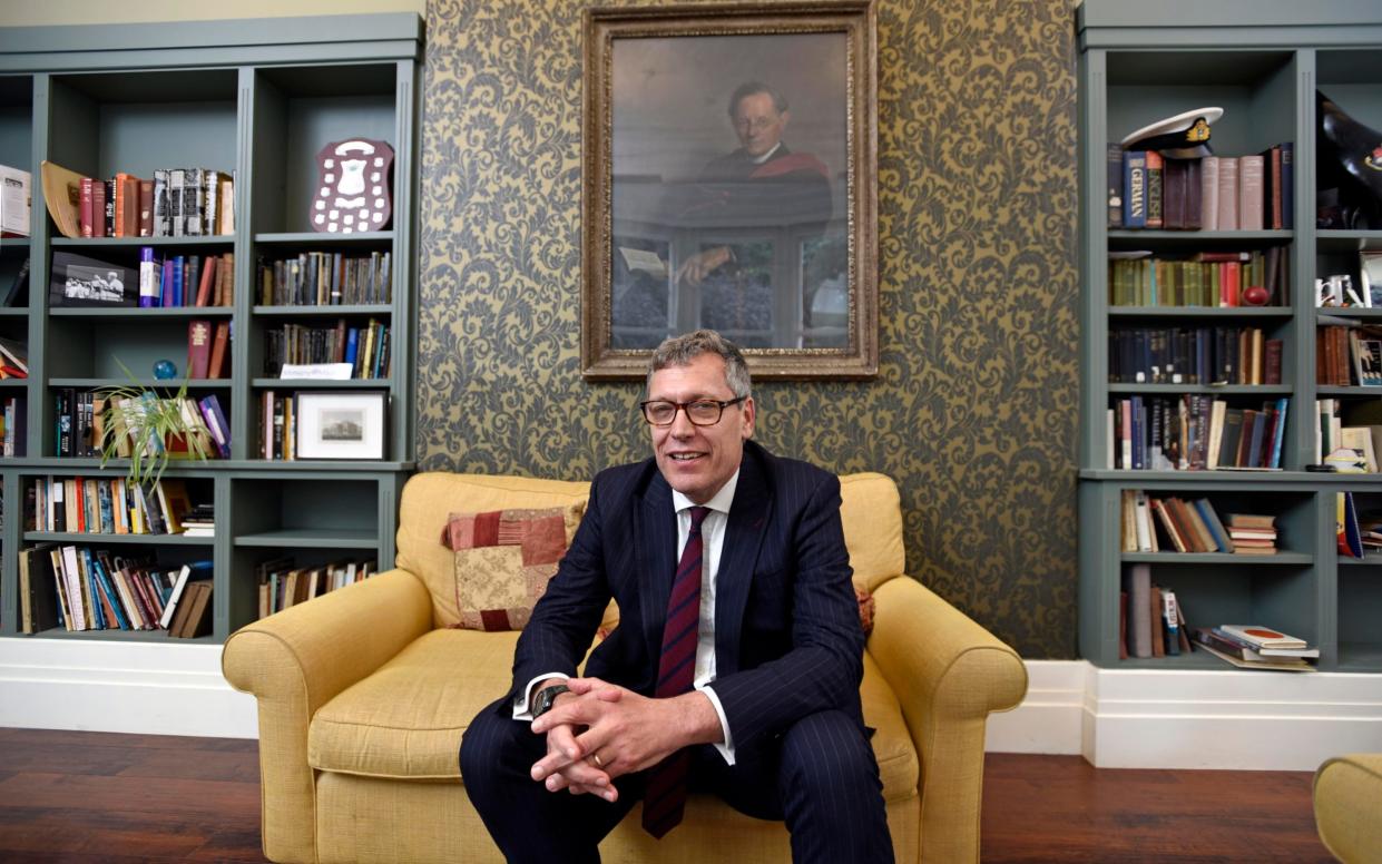 Van Mourik Broekman sat on a sofa in his office