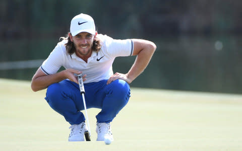 Tommy Fleetwood of England lines up a putt on the 17th green - Credit: Ross Kinnaird/Getty Images