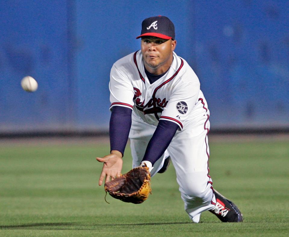 Andruw Jones, pictured making a diving catch for the Atlanta Braves in a 2007 game, is the featured speaker at the Greater Jacksonville High School Sports Awards.