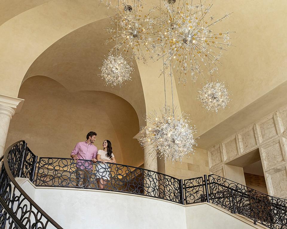 The lobby staircase at the Four Seasons Resort Orlando.