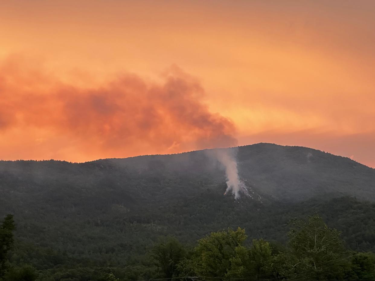 A wildfire in McDowell County continues to burn Aug. 1, 2023, expanding to ten acres since it began from a lightning strike July 28.