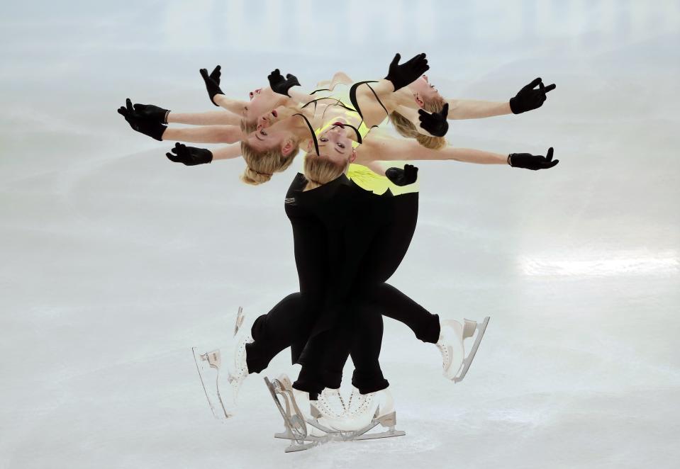 Gracie Gold of the U.S. practises her routine during a figure skating training session at the Iceberg Skating Palace training arena during the 2014 Sochi Winter Olympics February 17, 2014. Picture taken with multiple exposure. REUTERS/Lucy Nicholson (RUSSIA - Tags: SPORT FIGURE SKATING OLYMPICS TPX IMAGES OF THE DAY)