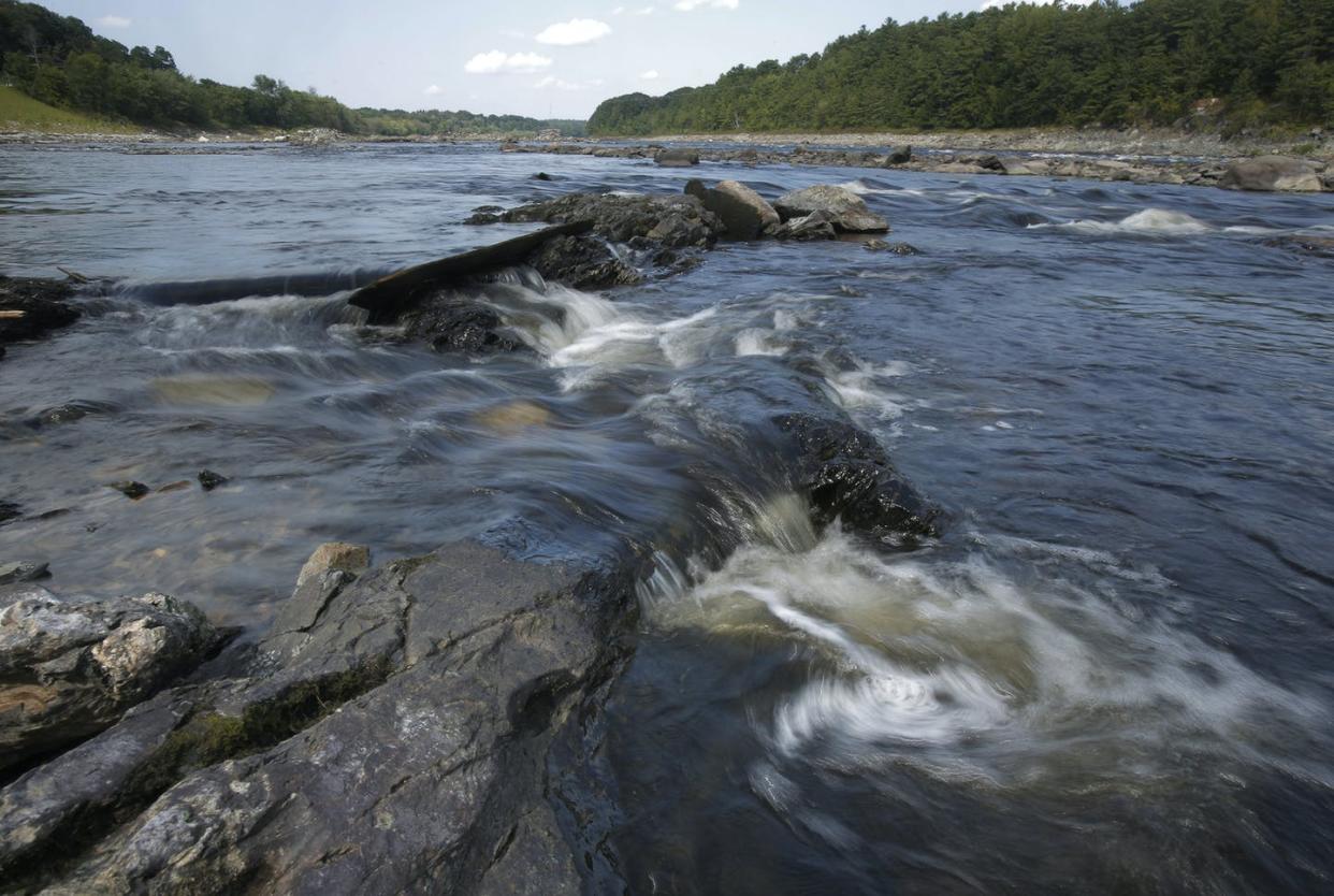 <span class="caption">Maine's Penobscot River flows freely where the Veazie Dam once stood. Dam removals have reopened the river to 12 native fish species.</span> <span class="attribution"><a class="link " href="https://www.gettyimages.com/detail/news-photo/the-penobscot-river-flows-free-where-the-veazie-dam-once-news-photo/490445262?adppopup=true" rel="nofollow noopener" target="_blank" data-ylk="slk:Gregory Rec/Portland Portland Press Herald via Getty Images;elm:context_link;itc:0;sec:content-canvas">Gregory Rec/Portland Portland Press Herald via Getty Images</a></span>