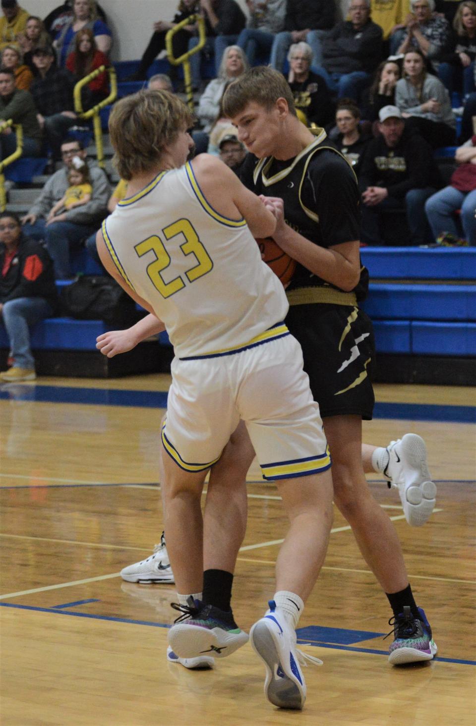 Maysville's Hayden Jarrett (white) and River View's Layton Massie (black) fight for a rebound during Friday's game. The Panthers won 88-67.