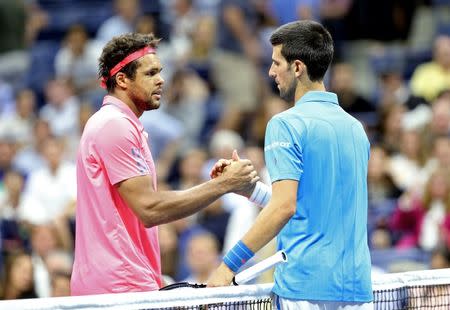 Sep 6, 2016; New York, NY, USA; Jo-Wilfried Tsonga of France shakes hands with Novak Djokovic of Serbia after the match on day nine of the 2016 U.S. Open tennis tournament at USTA Billie Jean King National Tennis Center. Mandatory Credit: Jerry Lai-USA TODAY Sports