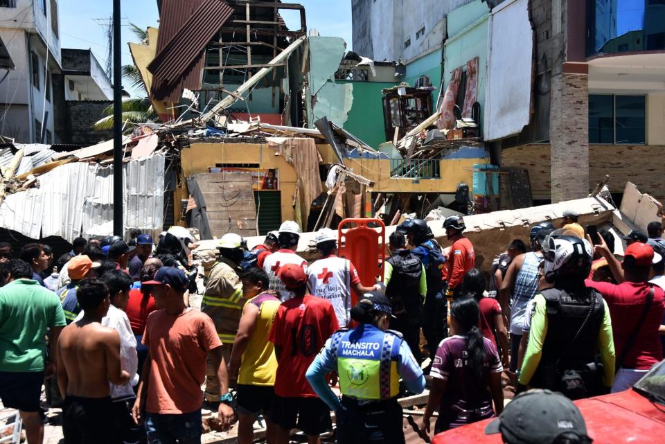 MACHALA, ECUADOR - MARCH 18: Rescuers work on a collapsed house after a magnitude 6.5 earthquake hit close to 12:12 pm on March 18, 2023 in Machala, Ecuador. The epicenter was located 6 kilometer north northeast of Balao, in the El Oro province. So far authorities confirmed 13 dead. (Photo by Jorge Sanchez/Agencia Press South/Getty Images)