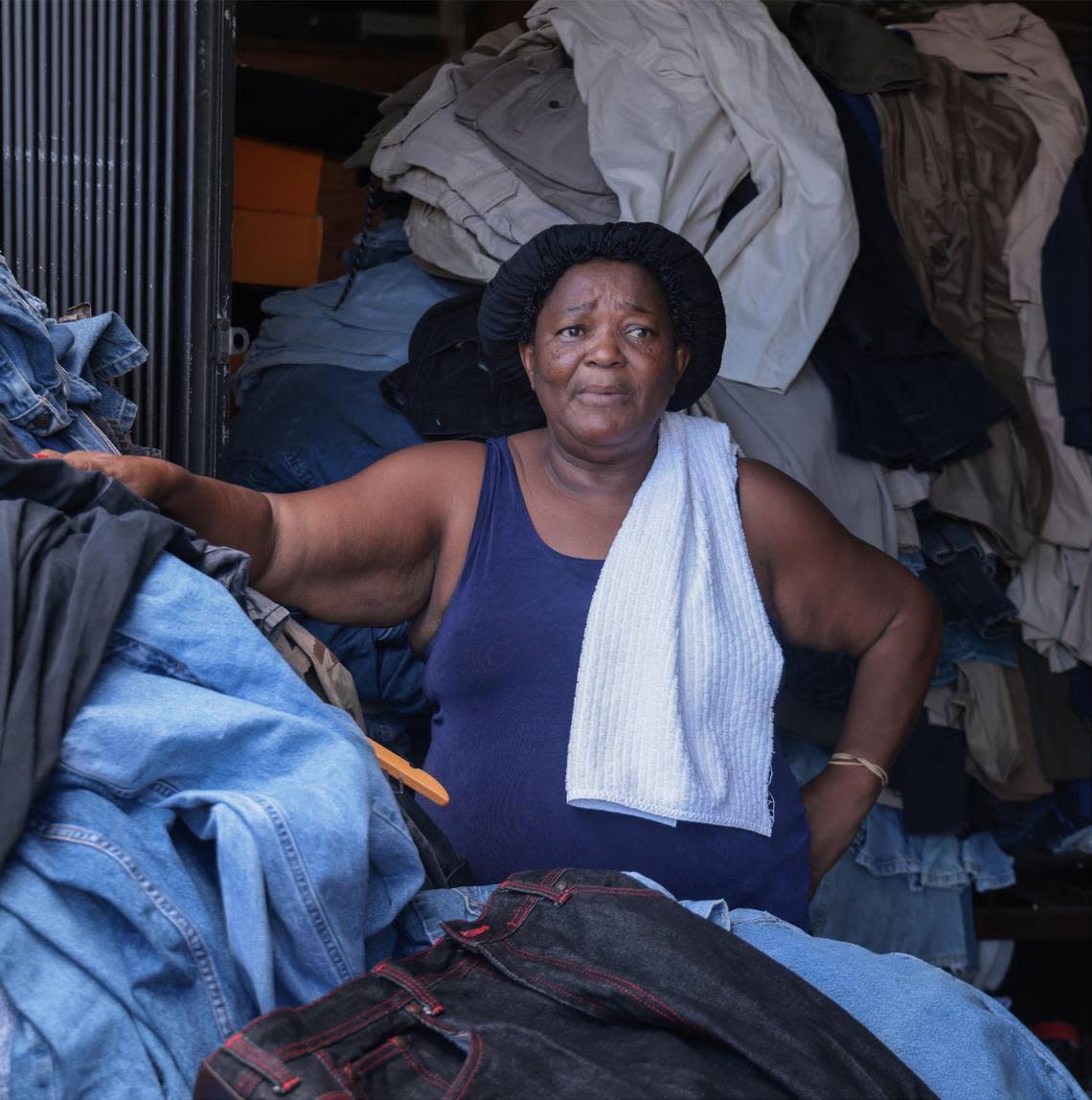 Nirvah Lamerique, 69, stands among the piles of jeans at her booth at the Opa-locka Hialeah Flea Market. The booth supplements her retirement income and she’s trying to figure out what to do after the market closes. ‘What are you supposed to do?’ she said walking through her crowded booth, where tables are stacked with construction worker shirts and pants, work boots, army fatigues and rolls of industrial toilet paper.