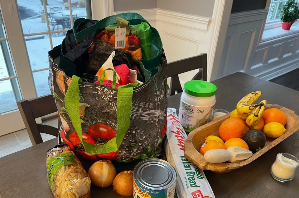 Reusable grocery bag filled with other reusable bags. A report on New Jersey's ban of one-time grocery bags shows that a reusable bag, is on average, "reused only two to three times before being discarded."