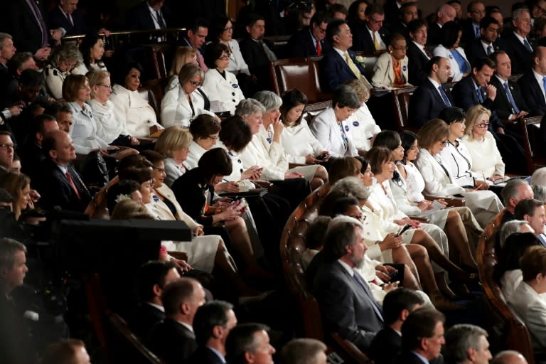 Members of Congress wear white to honor the women's suffrage movement and support women's rights as US President Donald Trump addresses a joint session of Congress on February 28, 2017 in the House Chamber at the Capitol