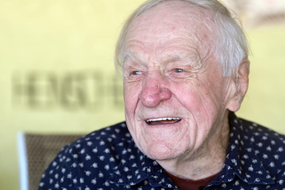 Tom Henschel smiles during an interview at his home Thursday, Jan. 25, 2024, in Tampa, Fla. Three football fans in their 80s are keeping their membership in the "never missed a Super Bowl" club. (AP Photo/Chris O'Meara)