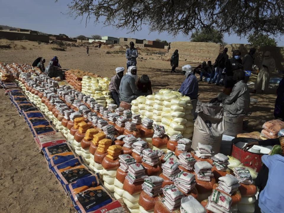 This handout photo provided by World Relief shows emergency food being distributed by World Food Programme (WFP) and World Relief in Kulbus, West Darfur, Sudan, end of March 2024. The United Nations said Friday, April 5, 2024, it has begun distributing food in Sudan’s war-ravaged Darfur province for the first time in months, following two successful cross-border operations, but the population still faces widespread starvation unless more help arrives. (World Relief via AP)