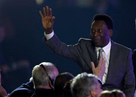 Former Brazil soccer player Pele waves his hand during the draw for the 2014 World Cup at the Costa do Sauipe resort in Sao Joao da Mata, Bahia state, December 6, 2013. REUTERS/Ricardo Moraes