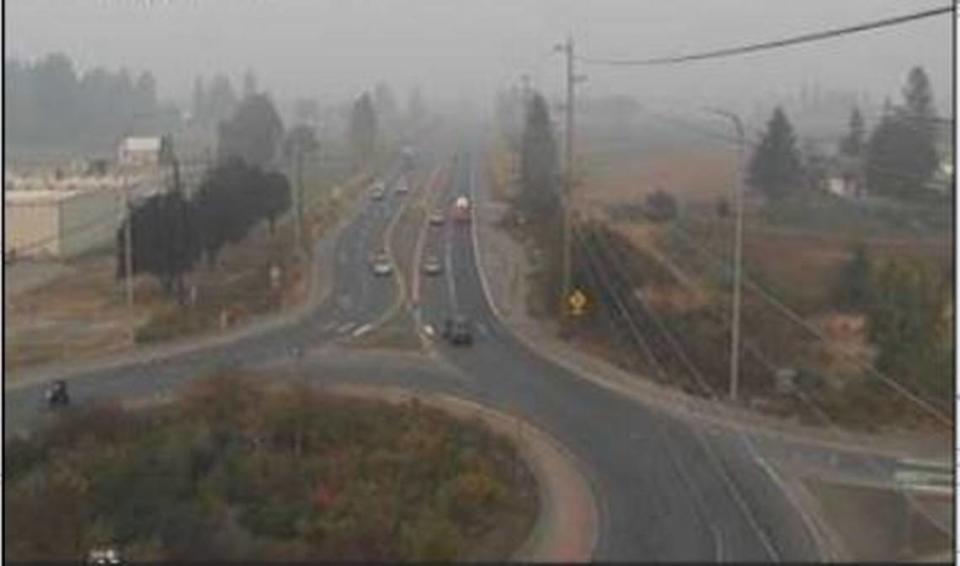 Smoke obscures the landscape on a Washington State Department of Transportation traffic camera at Guide Meridian/State Route 539 at Ten Mile Road in Whatcom County Tuesday afternoon, Oct. 18.