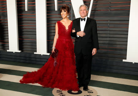 FILE PHOTO: President and Chief Executive Officer of CBS Corporation Les Moonves and his wife, Julie Chen, arrive at the Vanity Fair Oscar Party in Beverly Hills, California February 28, 2016. REUTERS/Danny Moloshok/File Photo