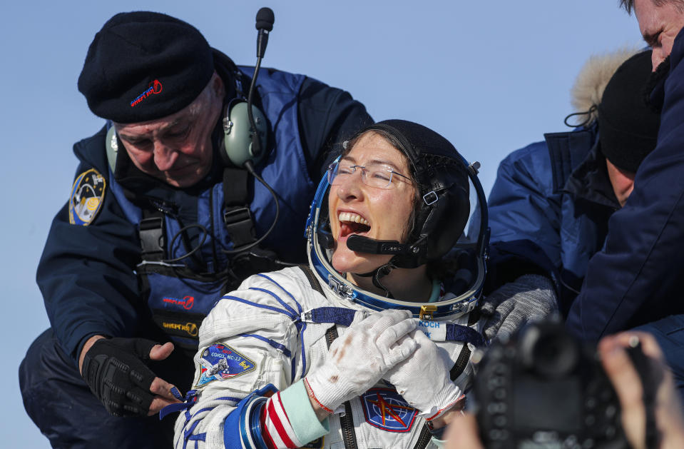 U.S. astronaut Christina Koch reacts shortly after the landing of the Russian Soyuz MS-13 space capsule about 150 km ( 80 miles) south-east of the Kazakh town of Zhezkazgan, Kazakhstan, Thursday, Feb. 6, 2020. A Soyuz space capsule with U.S. astronaut Christina Koch, Italian astronaut Luca Parmitano and Russian cosmonaut Alexander Skvortsov, returning from a mission to the International Space Station landed safely on Thursday on the steppes of Kazakhstan. Koch wrapped up a 328-day mission on her first flight into space, providing researchers the opportunity to observe effects of long-duration spaceflight on a woman as the agency plans to return to the Moon under the Artemis program. (Sergei Ilnitsky/Pool Photo via AP)