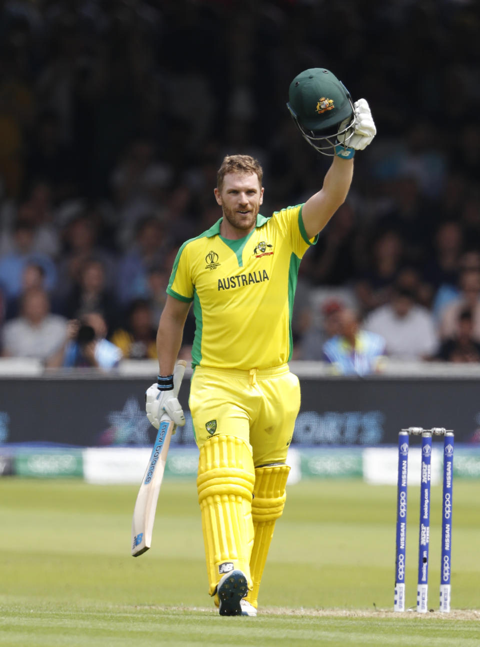 Australia's captain Aaron Finch celebrates getting 100 runs not out during their Cricket World Cup match between England and Australia at Lord's cricket ground in London, Tuesday, June 25, 2019. (AP Photo/Alastair Grant)