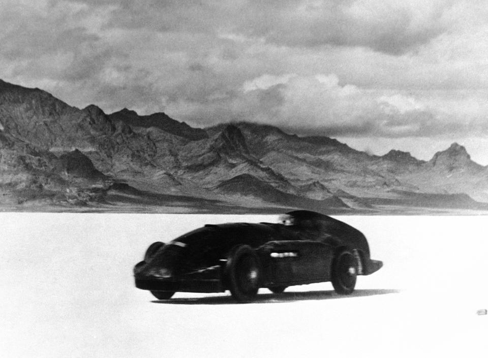 FILE - Captain George Eyston drives his Thunderbolt at the Bonneville Salt Flats, Utah on Nov. 6, 1937. The crust keeps tires cool at high speeds and provides an ideal surface for racing — unless seasonal flooding fails to recede or leaves behind an unstable layer of salt. (AP Photo, File)