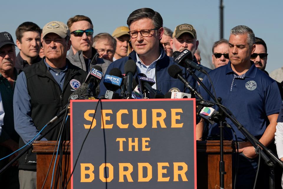 U.S. House Speaker Mike Johnson speaks while standing with Republican members of Congress, Wednesday, Jan. 3, 2024, in Eagle Pass, Texas. Johnson is leading about 60 fellow Republicans in Congress on a visit to the Mexican border. Their trip comes as they are demanding hard-line immigration policies in exchange for backing President Joe Biden's emergency wartime funding request for Ukraine. (AP Photo/Eric Gay) ORG XMIT: TXJC109