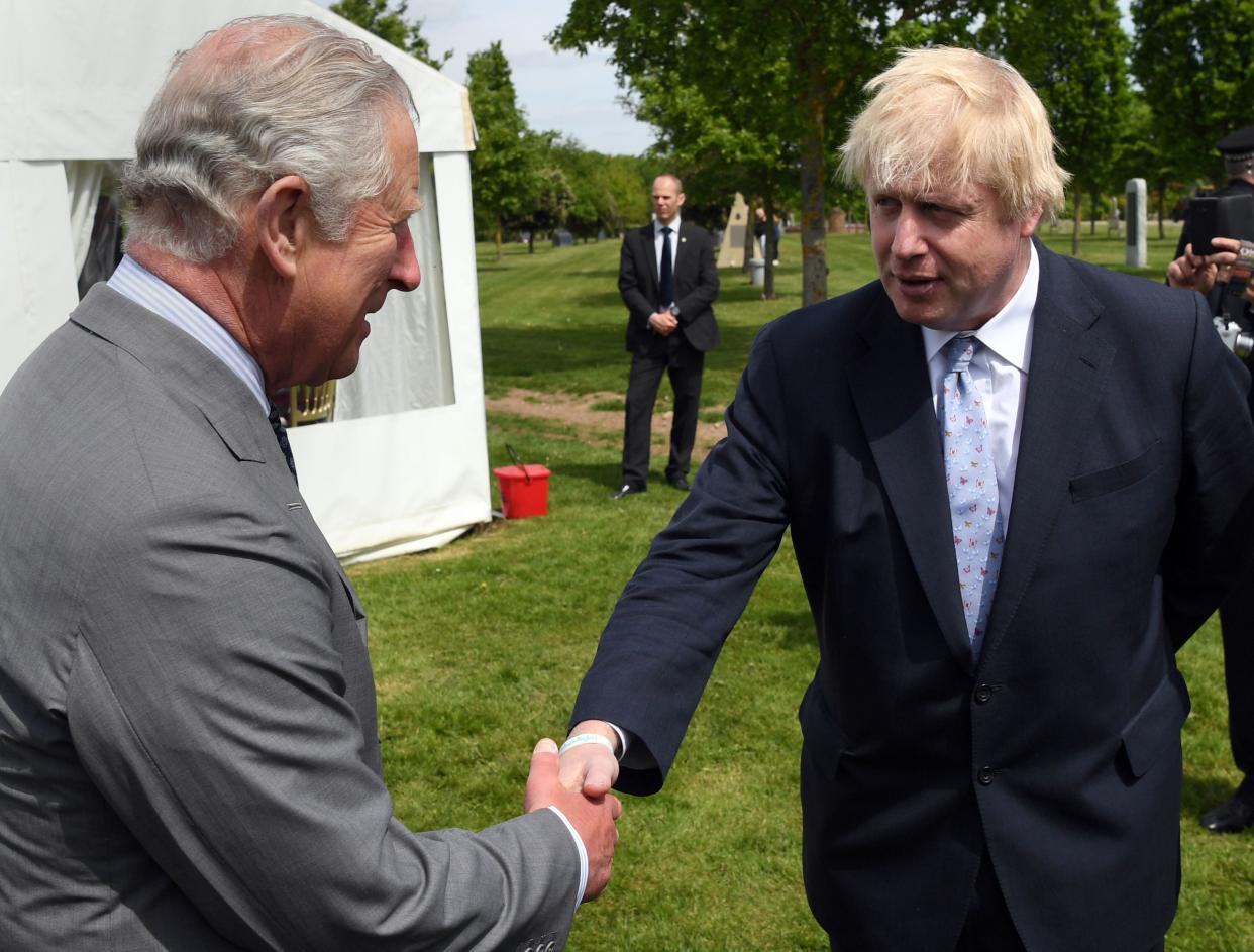 Britain's Prince Charles, Prince of Wales chats to Britain's Foreign Secretary Boris Johnson (R) following the dedication service for the National Memorial to British Victims of Overseas Terrorism at the National Memorial Arboretum in Alrewas, Staffordshire on May 17, 2018. (Photo by Paul ELLIS / various sources / AFP)        (Photo credit should read PAUL ELLIS/AFP via Getty Images)