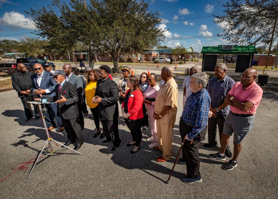 The rally of about 20 participants took place in the parking lot of Coney Funeral Home in Lakeland, across the street from the former site of Rochelle High School, an all Black high school until integration in 1969.