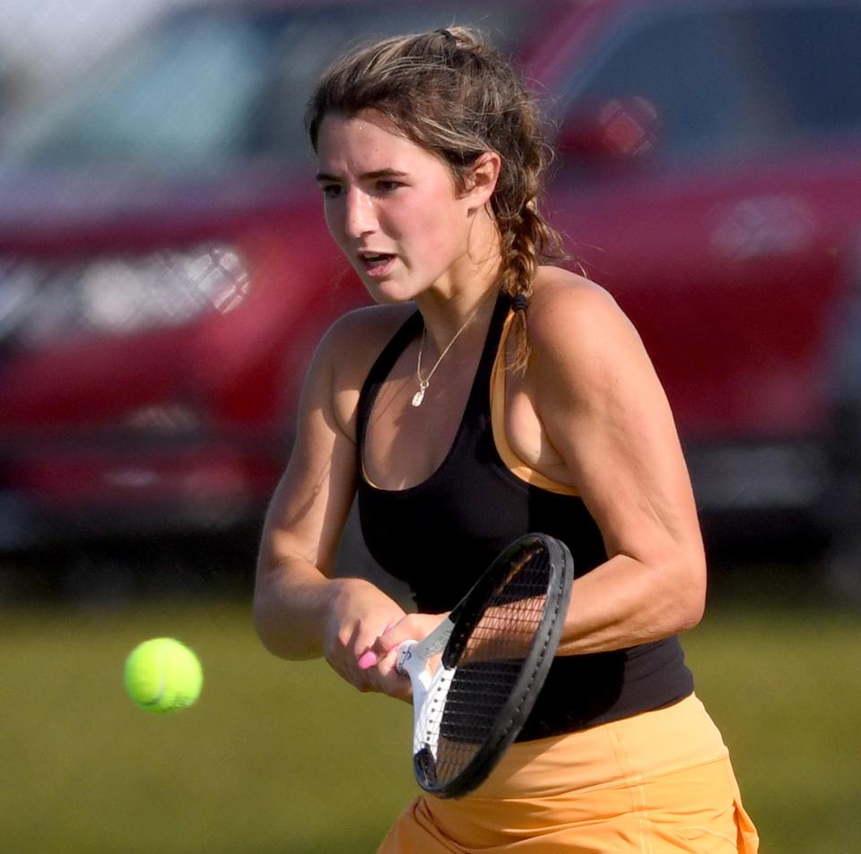 Hoover's Tess Bucher returns a ball against Hoban's Haley Slay, Wednesday, Sept. 20, 2023.