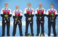Gold medallists Canada's Brad Jacobs, Ryan Fry, E.J. Harnden, Ryan Harnden and Caleb Flaxey (L-R) celebrate during the victory ceremony for the men's curling event at the 2014 Sochi Winter Olympics in Sochi, February 22, 2104. REUTERS/Eric Gaillard (RUSSIA - Tags: SPORT CURLING OLYMPICS)