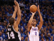 OKLAHOMA CITY, OK - MAY 31: Thabo Sefolosha #2 of the Oklahoma City Thunder shoots over Gary Neal #14 of the San Antonio Spurs in the third quarter in Game Five of the Western Conference Finals of the 2012 NBA Playoffs at Chesapeake Energy Arena on May 31, 2012 in Oklahoma City, Oklahoma. NOTE TO USER: User expressly acknowledges and agrees that, by downloading and or using this photograph, User is consenting to the terms and conditions of the Getty Images License Agreement. (Photo by Ronald Martinez/Getty Images)