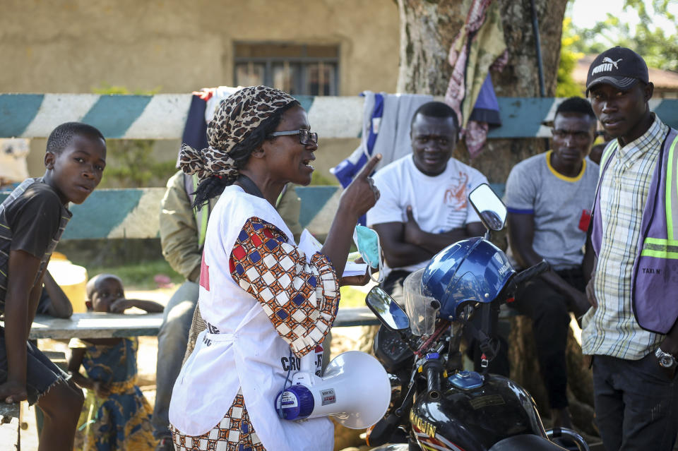 In this photo taken Tuesday, April 7, 2020, Katungo Methya, 53, who volunteers for the Red Cross educating the public about epidemics, talks about coronavirus prevention in Beni, eastern Congo. Congo has been battling an Ebola outbreak that has killed thousands of people for more than 18 months, and now it must also face a new scourge: the coronavirus pandemic. “It’s so upsetting to have this second disease. We lost so many people through Ebola, a lot of deaths, now corona,” she said. “Everyone is really afraid.” (AP Photo/Al-hadji Kudra Maliro)