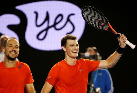 Britain's Jamie Murray (R) and Brazil's Bruno Soares celebrate after winning their doubles final match at the Australian Open tennis tournament at Melbourne Park, Australia, January 31, 2016. REUTERS/Issei Kato