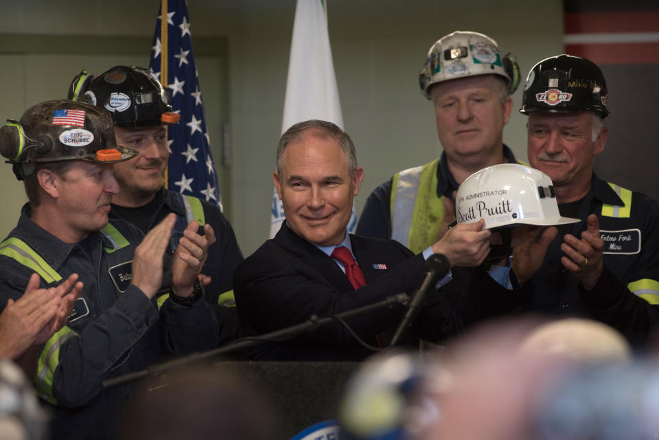 Scott Pruitt holds up a miner's helmet that he was given after speaking with coal miners at the Harvey Mine on April 13, 2017, in Sycamore, Pennsylvania. (Photo: Justin Merriman via Getty Images)