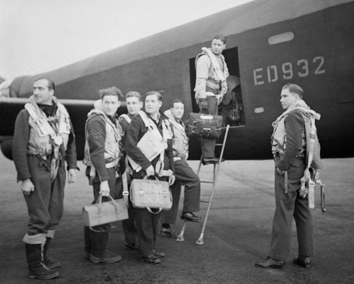 Undated handout photo issued by the Imperial War Museum of Wing Commander Gibson and his crew as they board their Avro Lancaster A3-G (ED 932/G) for the Dams' raid,  (left to right) Flight Lieutenant R D Trevor-Roper DEM; Sergeant J Pulford; Flight Sergeant G A Deering RCAF; Pilot Officer F M Spafford DFM RAAF; Flight Lieutenant R E G Hutchinson DFC; Wing Commander Guy Gibson; Pilot Officer H T Taerum RCAF, as British pilots from the Royal Navy and RAF who will form a new 617 Squadron, are training alongside the US Marine Corps on the F35B Lightning II jet at MCAS Beaufort, South Carolina, USA ahead of the aircraft entering service from 2018. PRESS ASSOCIATION Photo. Issue date: Monday May 16, 2016. The new 617 Squadron will be a combined team of Royal Navy and RAF personnel who will fly from both land and sea, based from RAF Marham and deployed periodically on the Queen Elizabeth Class Carriers. They will return to the UK in 2018 from their current training base of United States Marine Corps Air Station Beaufort in South Carolina, USA. See PA story DEFENCE Dambusters. Photo credit should read: Imperial War Museum/Richard Bayford/PA Wire  NOTE TO EDITORS: This handout photo may only be used in for editorial reporting purposes for the contemporaneous illustration of events, things or the people in the image or facts mentioned in the caption. Reuse of the picture may require further permission from the copyright holder.