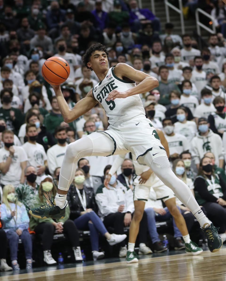 Michigan State guard Max Christie passes against Wisconsin during the first half on Tuesday, Feb. 8, 2022, at the Breslin Center.