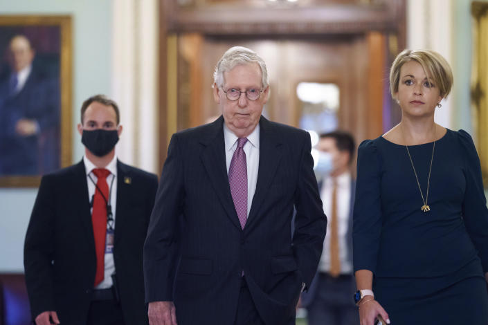 Senate Minority Leader Mitch McConnell, R-Ky., returns to his office from the Senate chamber before votes, at the Capitol in Washington, Thursday, Sept. 30, 2021. (AP Photo/J. Scott Applewhite)