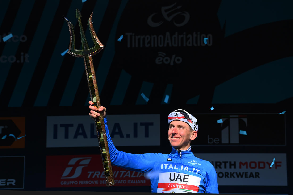 SAN BENEDETTO DEL TRONTO, ITALY - MARCH 13: Tadej Pogacar of Slovenia and UAE Team Emirates Blue Leader Jersey celebrates at podium as race winner with the Trident race trophy during the 57th Tirreno-Adriatico 2022 - Stage 7 a 159km stage from San Benedetto del Tronto to San Benedetto del Tronto / #TirrenoAdriatico / #WorldTour / on March 13, 2022 in San Benedetto del Tronto, Italy. (Photo by Tim de Waele/Getty Images)