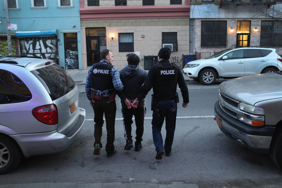 U.S. Immigration and Customs Enforcement (ICE) officers arrest an undocumented Mexican immigrant in Brooklyn, New York. (Photo: John Moore/Getty Images)