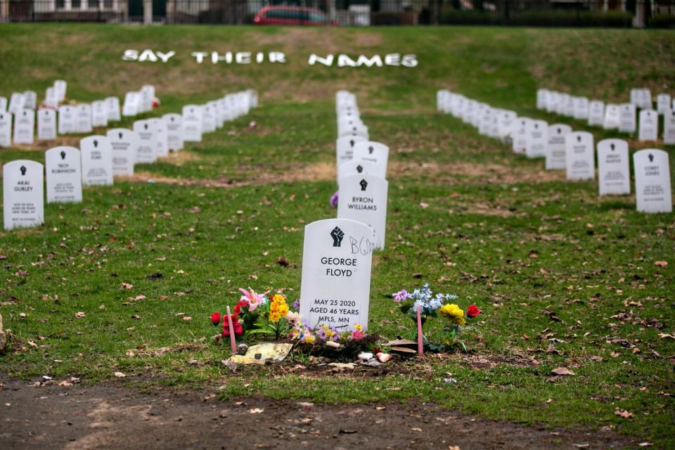 Mock headstones at the "Say Their Names' cemetery pay tribute to Black people killed by police.