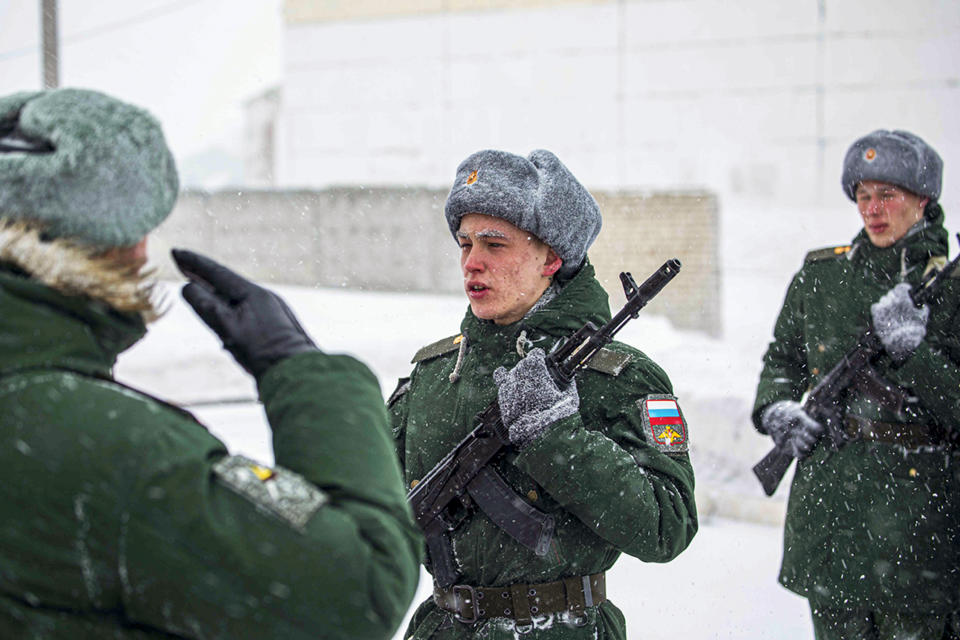 In this photo released by the Russian Defense Ministry Press Service on Jan. 22, 2022, servicemen of the engineer-sapper regiment take the military oath in the Voronezh Region, Russia. (Russian Defense Ministry Press Service via AP)