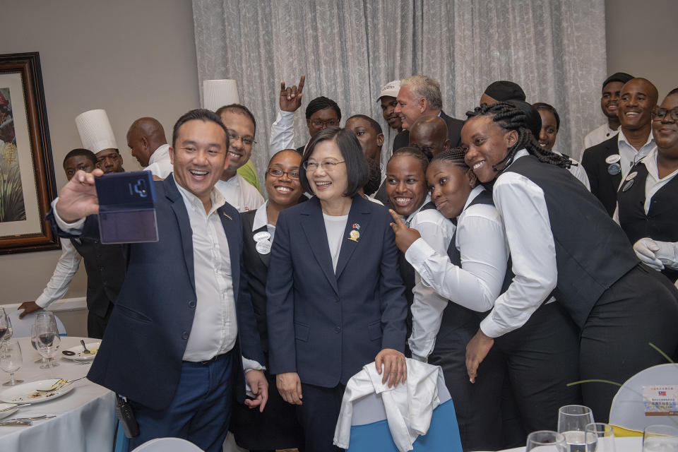 In this photo released by the Taiwan Presidential Office, Taiwanese President Tsai Ing-wen poses for photos in St. Lucia on Thursday, July 18, 2019. Tsai said she would follow "humanitarian principles" in dealing with asylum seekers from Hong Kong during a visit this week to Saint Lucia, an eastern Caribbean island nation that is among Taiwan's few remaining allies. (Taiwan Presidential Office via AP)