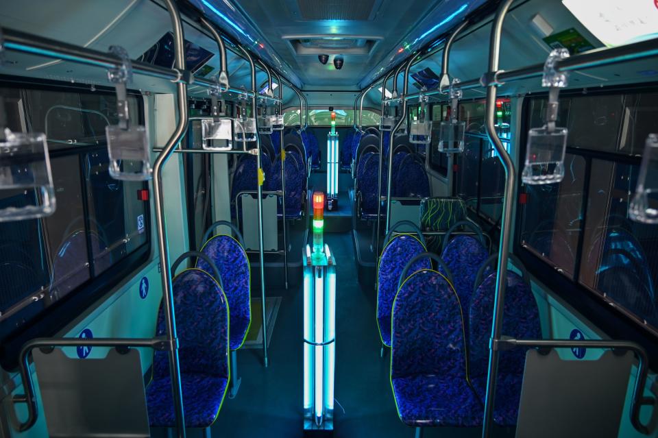 TOPSHOT - A bus has been disinfected with ultraviolet rays as part of measures against of the COVID-19 coronavirus in Shanghai on March 12, 2020 (Photo by Hector RETAMAL / AFP) (Photo by HECTOR RETAMAL/AFP via Getty Images)