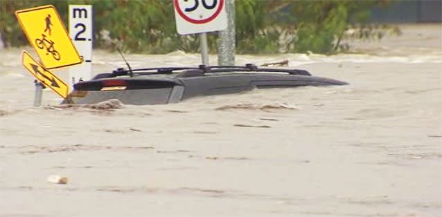 Cars underwater in storms that battered QLD yesterday as flood warnings are put in place for NSW. Photo: 7News