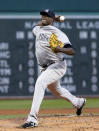 New York Yankees starting pitcher Michael Pineda delivers to the Boston Red Sox during the first inning of a baseball game at Fenway Park in Boston, Wednesday, April 23, 2014. (AP Photo/Elise Amendola)