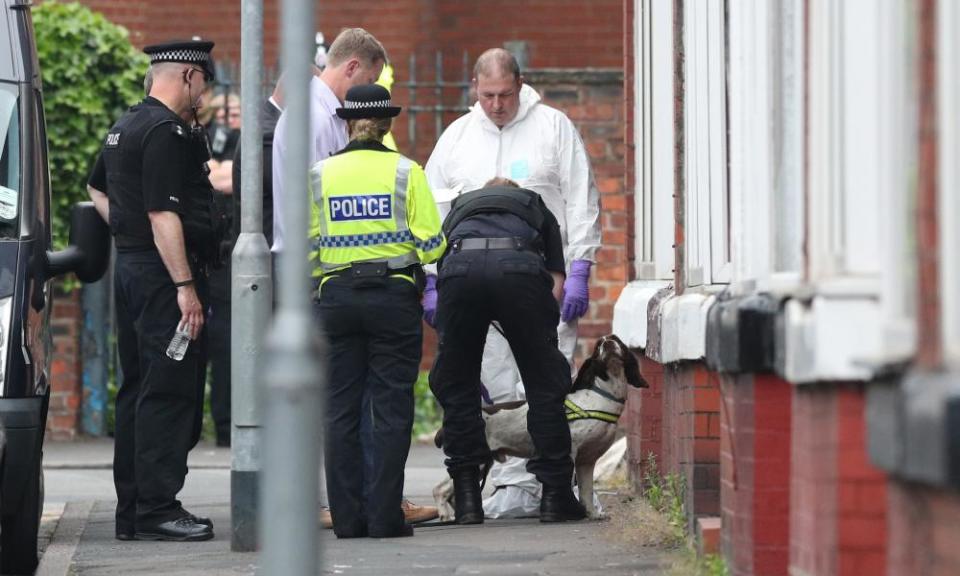 Police with a sniffer dog at an address in Banff Road, Rusholme