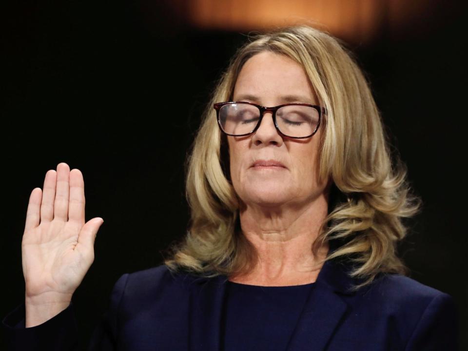 Christine Blasey Ford is sworn in before testifying.