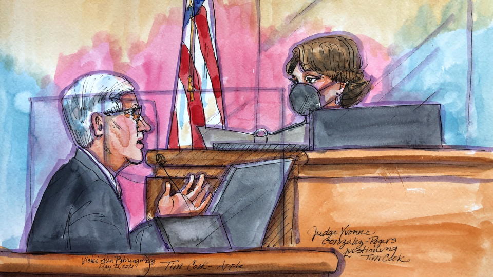 Apple CEO Tim Cook is questioned by Judge Yvonne Gonzalez Rogers as he testifies on the stand during a weeks-long antitrust trial at federal court in Oakland, California, U.S. May 21, 2021 in this courtroom sketch. Cook on Friday told a court that threats to iPhone security and privacy required tight control of the App Store, which 