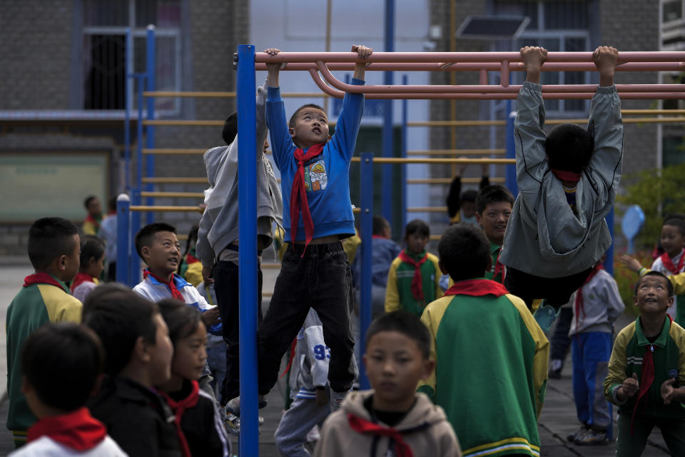 Tibetan students play in their break time at the Shangri-La Key Boarding School during a media-organized tour in Dabpa county, Kardze Prefecture, Sichuan province, China on Sept. 5, 2023. (AP Photo/Andy Wong)