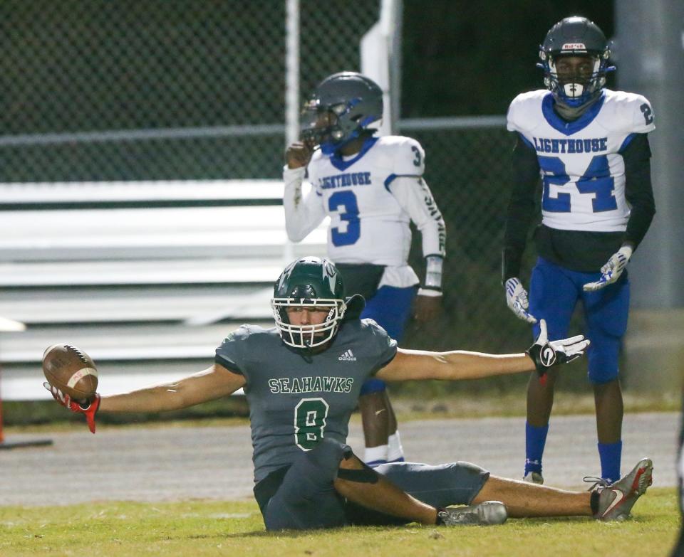 WR Pearce Spurlin reacts after making a rolling reception during the Seahawks final regular season football game at home against Lighthouse Private Christian Academy.