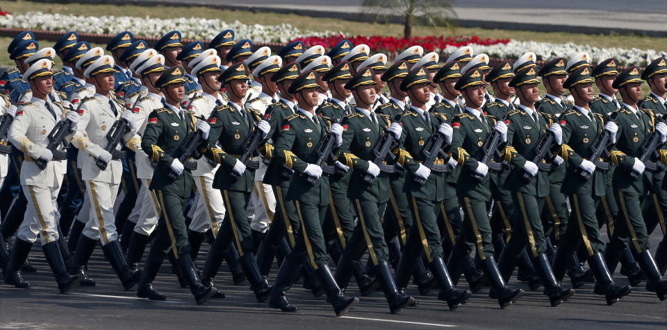 A contingent of the Chinese People's Liberation Army march during a military parade to mark Pakistan's Republic Day, in Islamabad, Pakistan, Thursday, March 23, 2017. President Mamnoon Hussain said Pakistan is ready to hold talks with India on all issues, including Kashmir, as he opened the annual military parade. During the parade, attended by several thousand people, Pakistan displayed nuclear-capable weapons, tanks, jets, drones and other weapons systems. (AP Photo/Anjum Naveed)